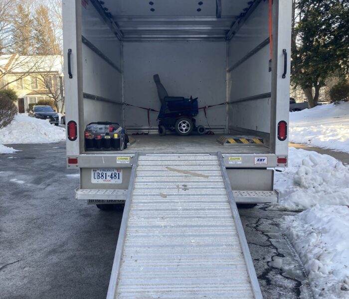 Power wheelchair in a delivery cube van