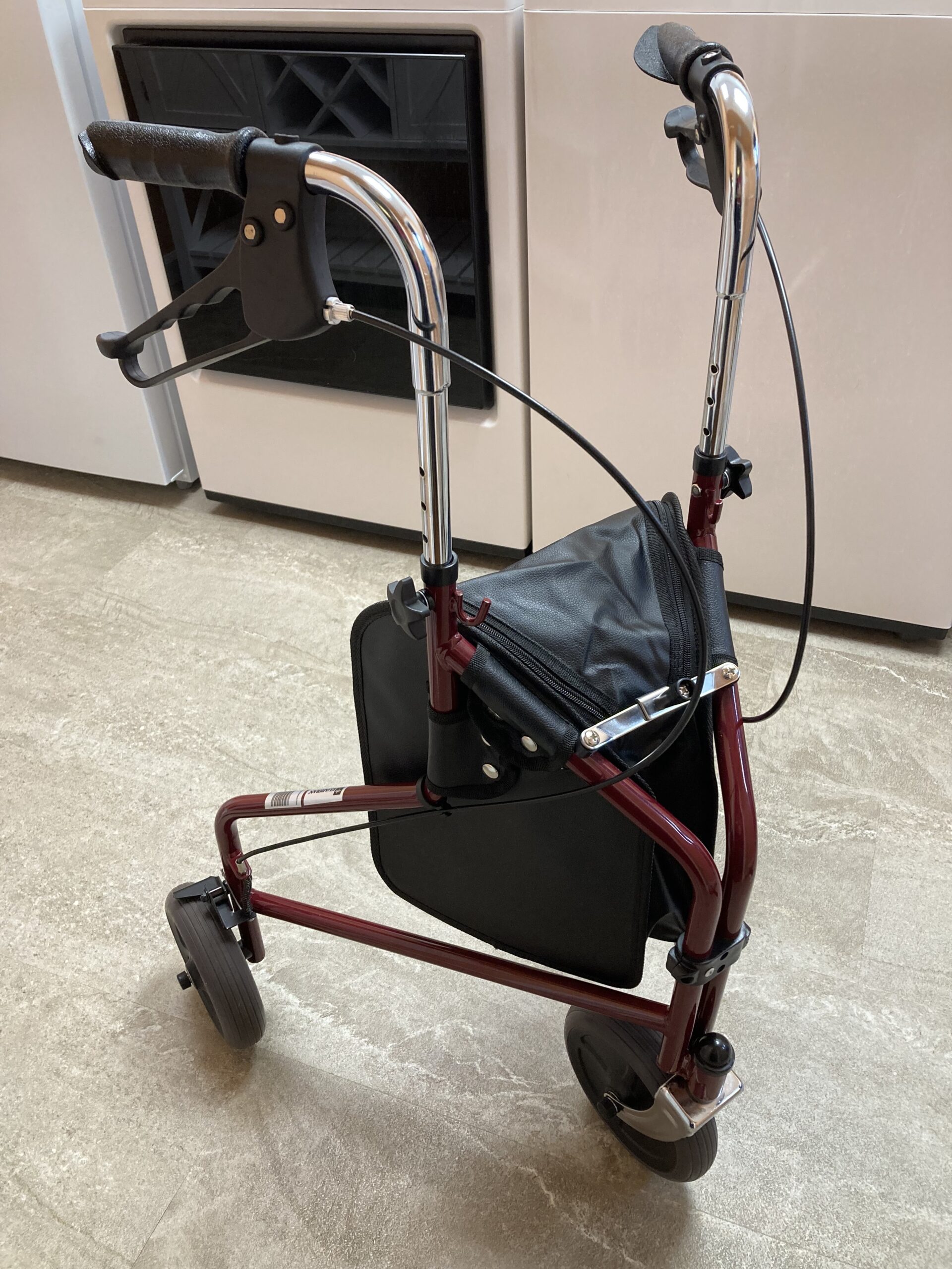 3-wheeled red rollator