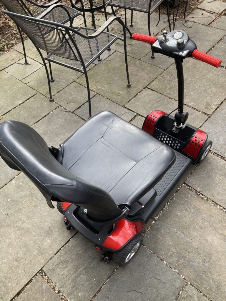 Red GoGo Elite mobility scooter, quarter rear view