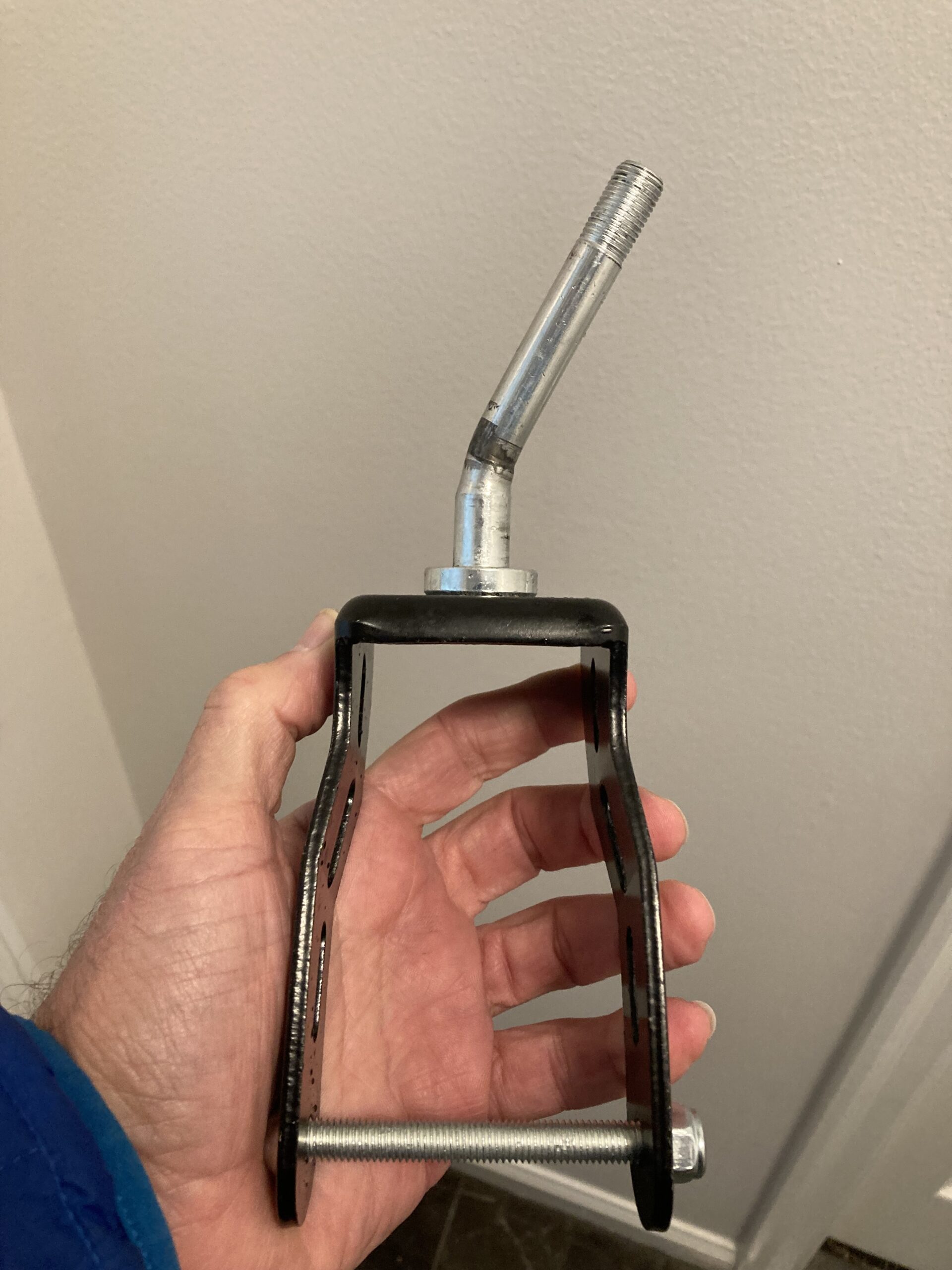 Bent power wheelchair caster wheel fork