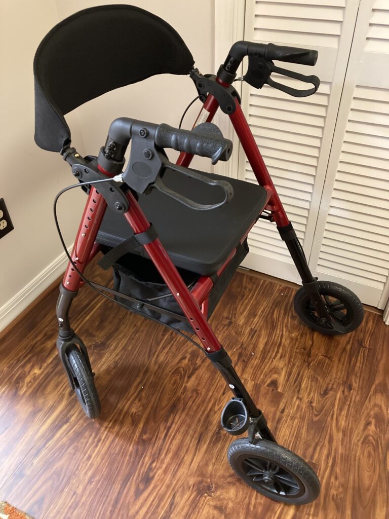 Burgundy red Elenker brand rolling walker, rear view.