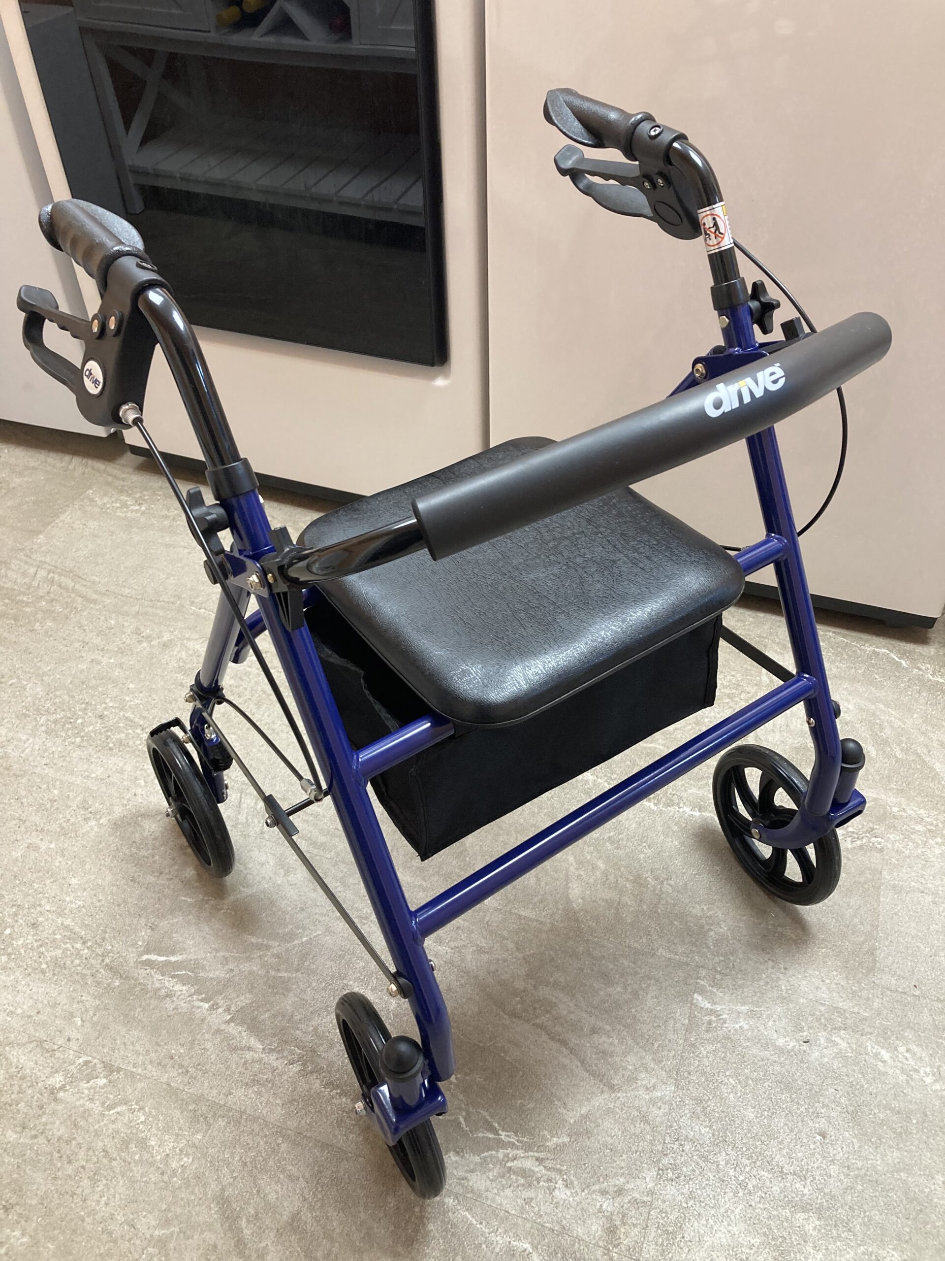 Compact blue Drive brand rollator